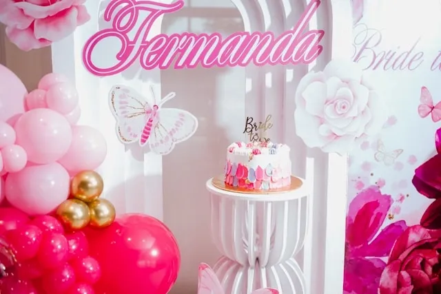 a pink-themed backdrop for engagement party backdrop ideas