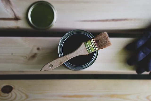 a tin of sealer and a brush for how to make paper coasters waterproof