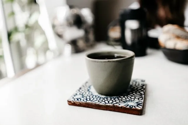 a drink on a patterned coaster for how to make tile coasters waterproof