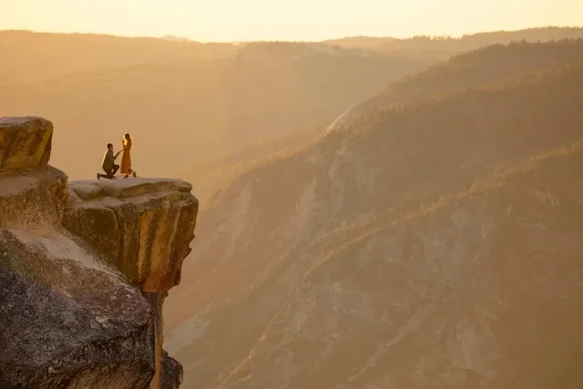 a person proposing on a cliff edge for valentines proposal ideas