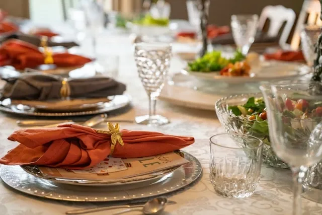 an elegant table setting for how to fold napkins with rings