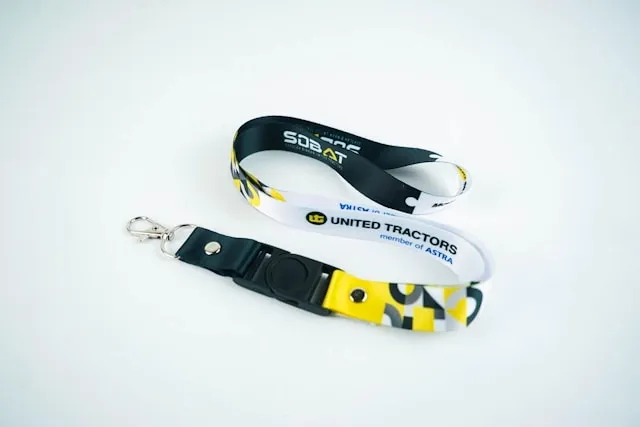 a lanyard on a white surface for how to wear a lanyard