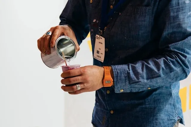 a person pours a drink for how to wear a lanyard