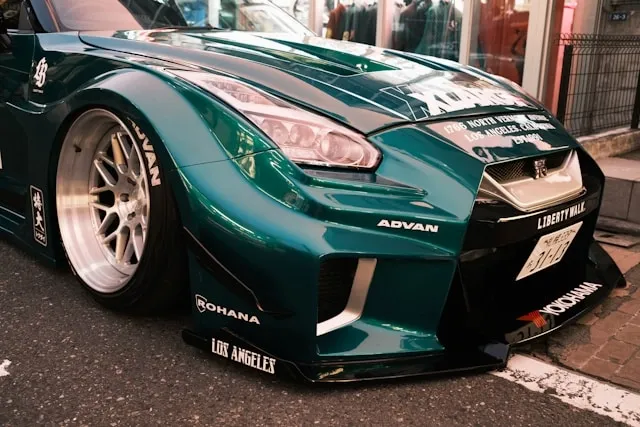 the front section of a green car for do magnets stick to cars