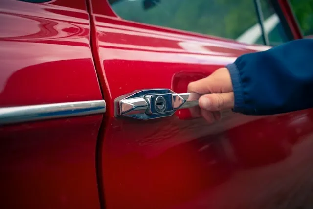 the side panel of a red car for do magnets stick to cars