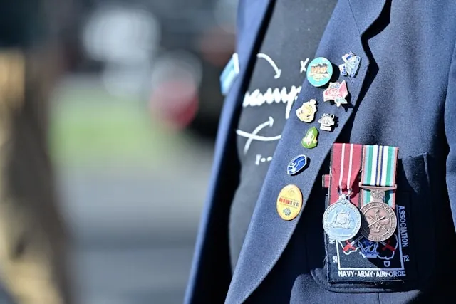 a person wearing multiple lapel pins for lapel pin placement