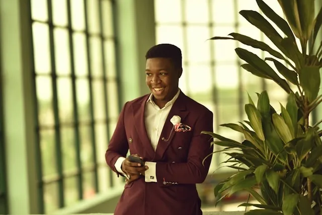 a person wearing a smart blazer for lapel pin placement