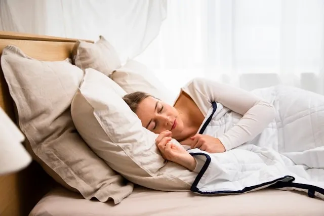 a person lying under a heated blanket for how to wash a heated blanket a person lying under a heated blanket for how to wash a heated blanket
