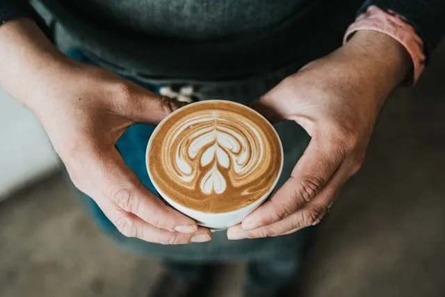 a person holding a mug of coffee for free crochet coffee cup coaster pattern a person holding a mug of coffee for free crochet coffee cup coaster pattern