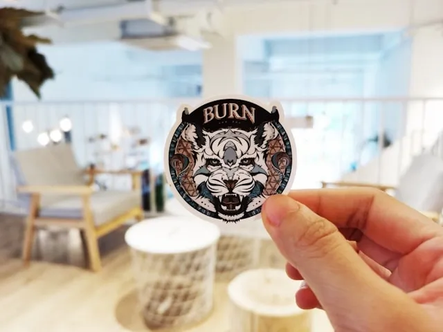 a person holding a woven patch for how are woven patches made a person holding a woven patch for how are woven patches made