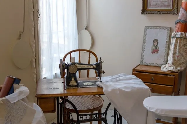sewing a tablecloth with an old-fashioned sewing machine for how to make a tablecloth