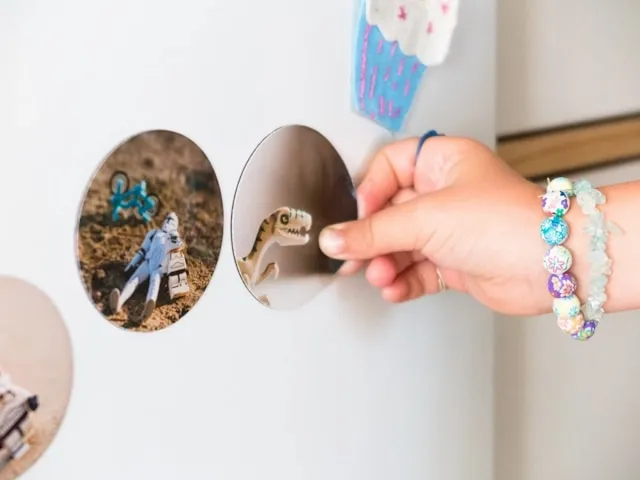 a person placing some custom fridge magnets for how are permanent magnets made a person placing some custom fridge magnets for how are permanent magnets made