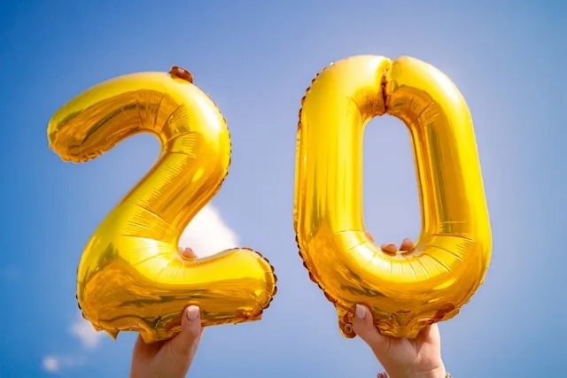a person holding up two foil balloons outdoors for how to deflate foil balloons a person holding up two foil balloons outdoors for how to deflate foil balloons