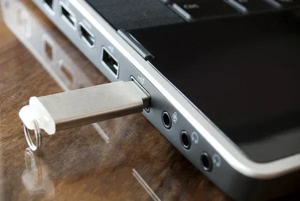 Flash drive plugged into computer via USB Flash drive plugged into computer via USB