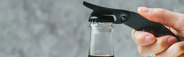 Man opening beer bottle Man opening beer bottle