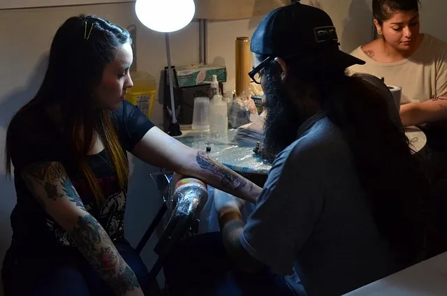 tattoo-artist-working-in-modern-studio tattoo-artist-working-in-modern-studio