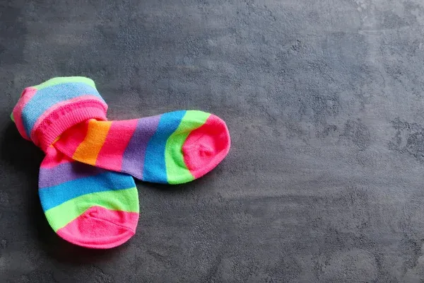 Colorful socks on grey background Colorful socks on grey background