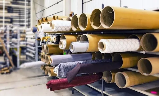 Rolled tablecloth panels stored on tubes, showing how a reusable backdrop is rolled up for storage between events.jpg Rolled tablecloth panels stored on tubes, showing how a reusable backdrop is rolled up for storage between events.jpg