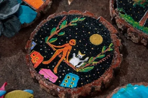 Set of hand-painted wooden coasters with sealed, glossy designs arranged on a table.jpg Set of hand-painted wooden coasters with sealed, glossy designs arranged on a table.jpg
