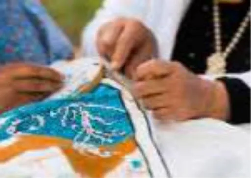 Close-up of hands hand-tufting colorful yarn embroidery, illustrating the chenille patch technique used to make DIY patches without a machine.jpg Close-up of hands hand-tufting colorful yarn embroidery, illustrating the chenille patch technique used to make DIY patches without a machine.jpg