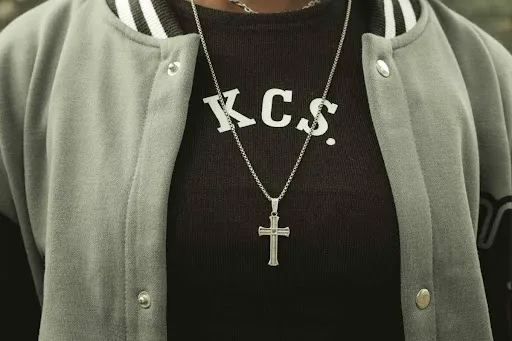 Close-up of a varsity letterman jacket with plush white chenille varsity letter patches spelling KCS on the chest.jpg Close-up of a varsity letterman jacket with plush white chenille varsity letter patches spelling KCS on the chest.jpg