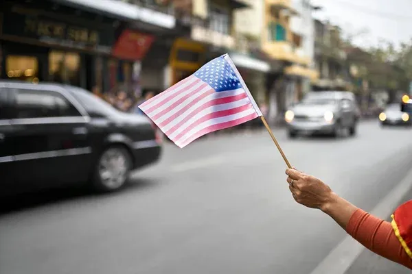 Woman waving US flag Woman waving US flag