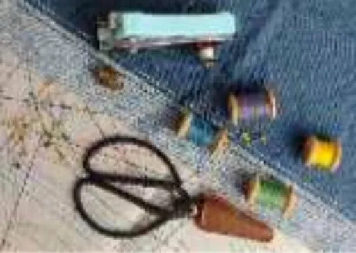 Flat-lay of DIY patch-making supplies without an embroidery machine, including denim fabric, colorful thread spools, scissors, sewing pins, and a thimble.jpg Flat-lay of DIY patch-making supplies without an embroidery machine, including denim fabric, colorful thread spools, scissors, sewing pins, and a thimble.jpg