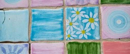Finished colorful hand-painted ceramic tile coasters arranged together, showing the final decorated and sealed DIY coaster set.jpg Finished colorful hand-painted ceramic tile coasters arranged together, showing the final decorated and sealed DIY coaster set.jpg
