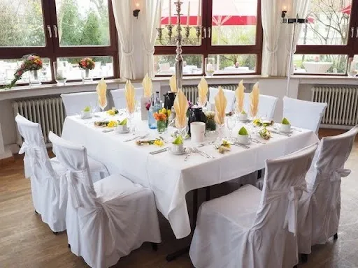 54 x 108 white tablecloth draped over a 6-foot rectangular banquet table, showing the side and end drop overhang.jpg 54 x 108 white tablecloth draped over a 6-foot rectangular banquet table, showing the side and end drop overhang.jpg