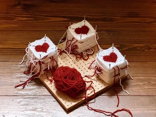 Heart-shaped crochet coasters in red and white on a wooden pegboard, a festive holiday crochet coaster pattern idea.jpg Heart-shaped crochet coasters in red and white on a wooden pegboard, a festive holiday crochet coaster pattern idea.jpg