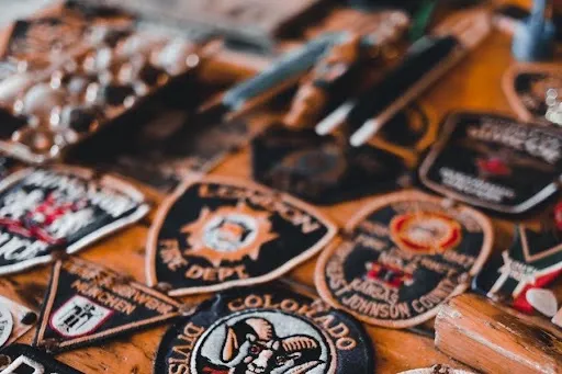 Collection of finished applique-style patches with clean merrowed borders in assorted team and organization colors.jpg Collection of finished applique-style patches with clean merrowed borders in assorted team and organization colors.jpg