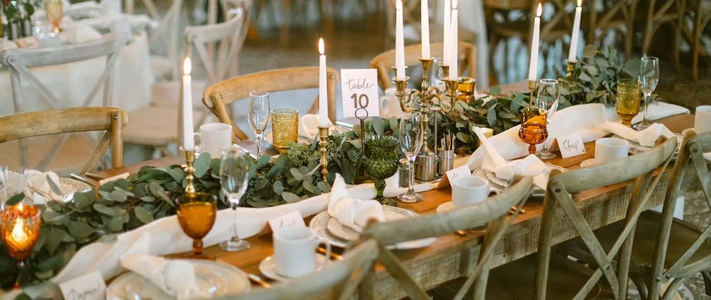 Luxury wedding head table with velvet bench, gold candlesticks, and greenery garland runner-large.jpg Luxury wedding head table with velvet bench, gold candlesticks, and greenery garland runner-large.jpg