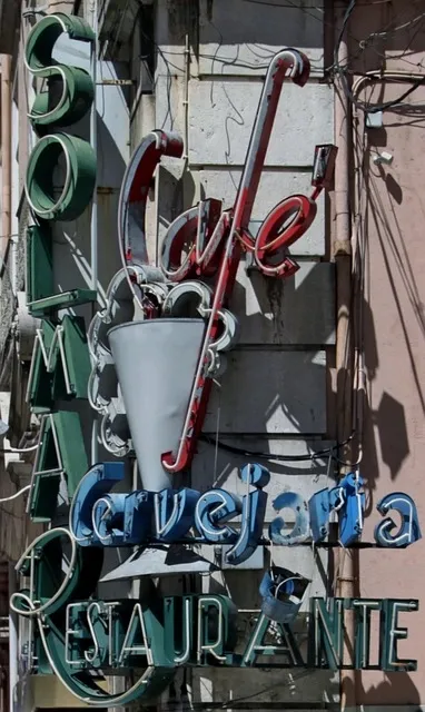 weathered vintage cafe neon sign with aged metal lettering weathered vintage cafe neon sign with aged metal lettering