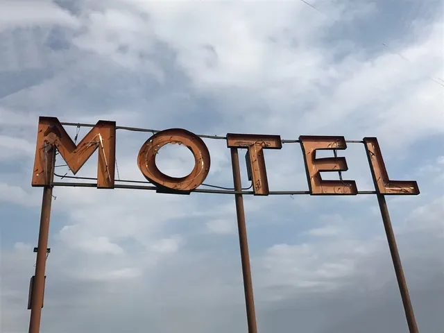 weathered vintage motel sign with aged metal letters weathered vintage motel sign with aged metal letters