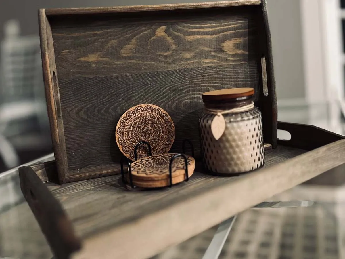 Set of natural fiber coasters stacked in a wooden holder, a decorative option for sweaty drinks Set of natural fiber coasters stacked in a wooden holder, a decorative option for sweaty drinks