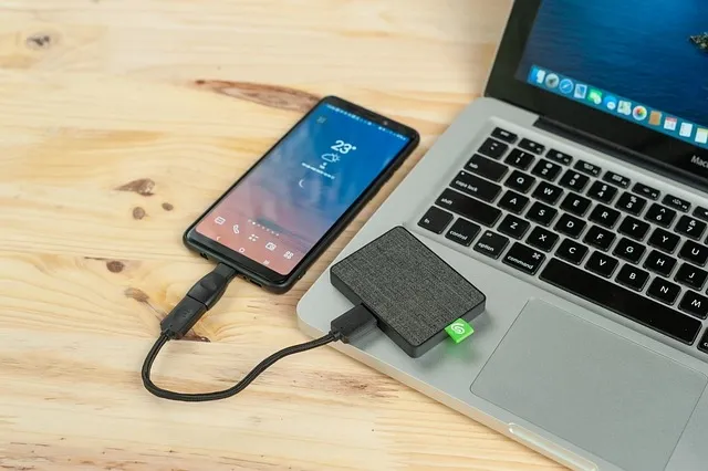 smartphone connected to laptop and external drive smartphone connected to laptop and external drive