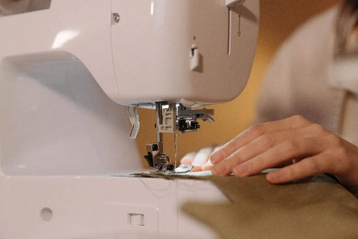 Sewing machine stitching a dense border around a fabric patch during a home patch-making project.jpg Sewing machine stitching a dense border around a fabric patch during a home patch-making project.jpg