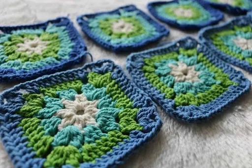 Green, white and yellow crocheted cotton textile showing color changes and stitch structure used in a crochet star coaster pattern for coordinated sets.jpg Green, white and yellow crocheted cotton textile showing color changes and stitch structure used in a crochet star coaster pattern for coordinated sets.jpg