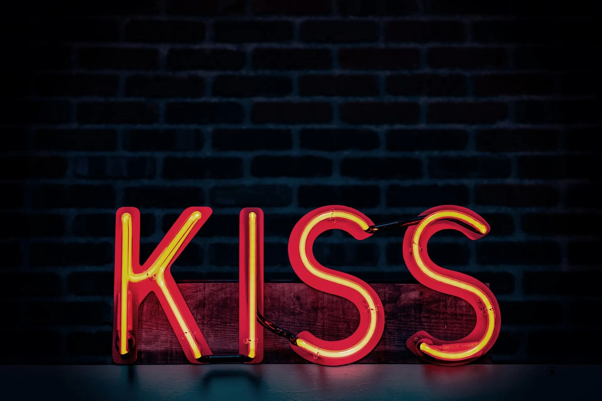 a red neon lips design mounted on a dark wall for red neon sign aesthetic a red neon lips design mounted on a dark wall for red neon sign aesthetic