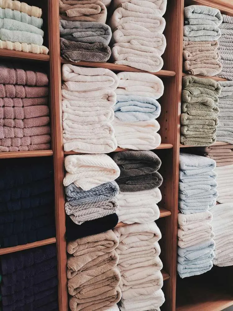 folded towels on shelves folded towels on shelves