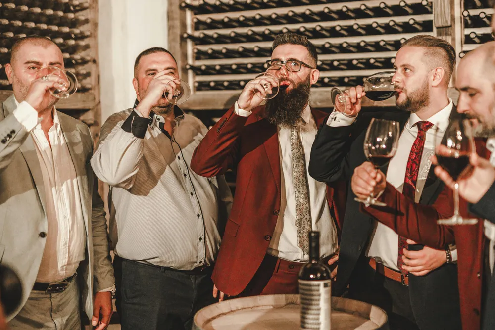 a group of men drinking together for bachelor party checklist