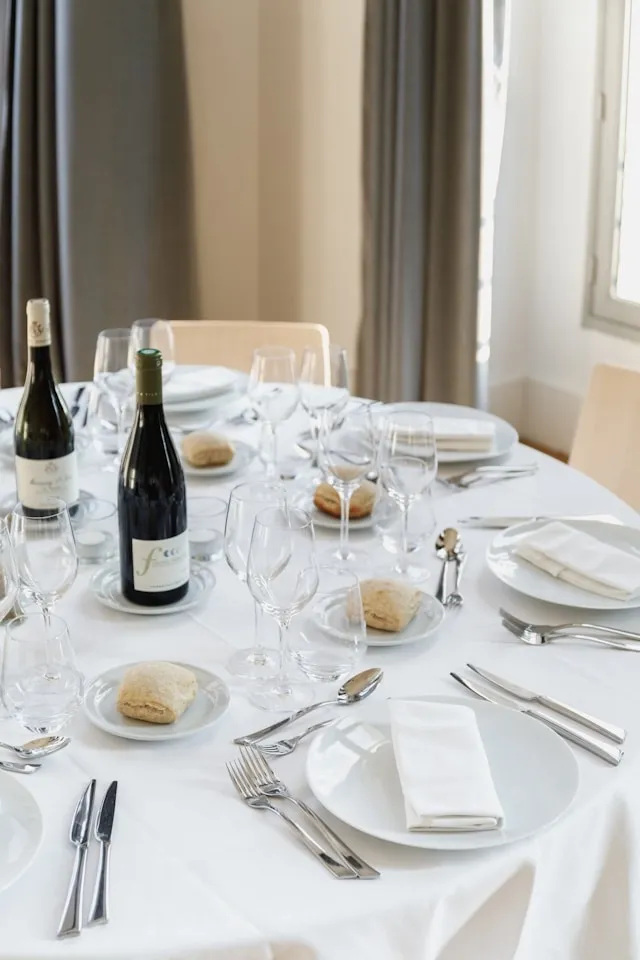 a formal table setting for how many chairs fit around a 60-inch round table