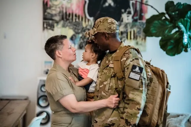 a man in uniform with a woman and child for gift ideas for someone going into the army