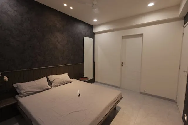 a dark accent wall in a bedroom for accent wall ideas