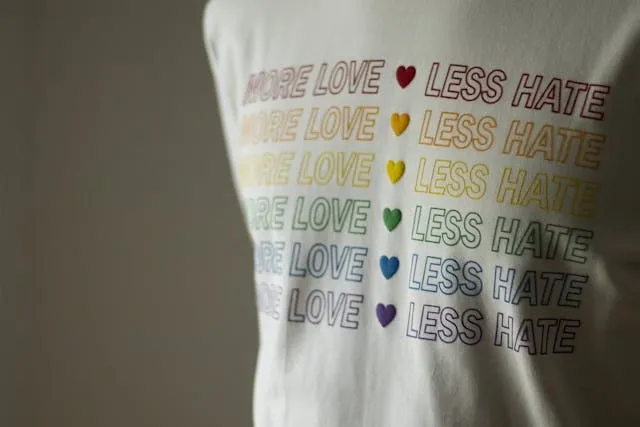 a white t-shirt with colored lettering for how to take off iron on letters