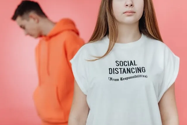 a person wearing a t-shirt with a humorous message for how to iron on letters