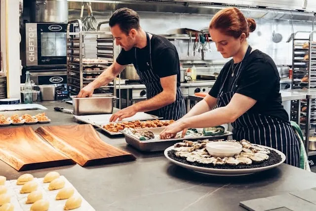 people preparing food in a commercial kitchen for equipment for restaurant