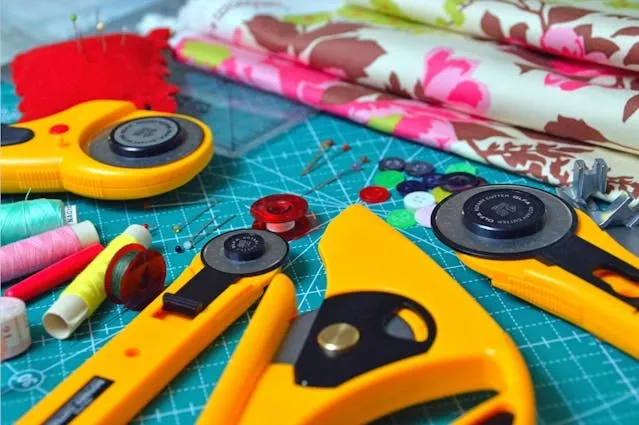 an array of sewing supplies for how to make fabric coasters