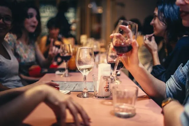 a group of people sitting around a table in a restaurant for equipment for restaurant