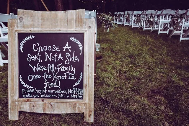 a chalkboard welcome sign with a humorous message for wedding welcome sign ideas